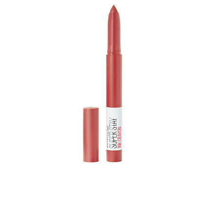 Lipstick with cap on a white background