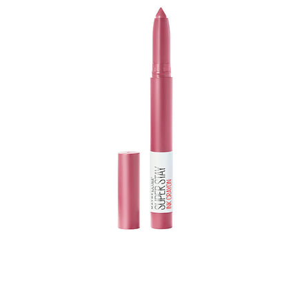 Pink lipstick with cap on a white background
