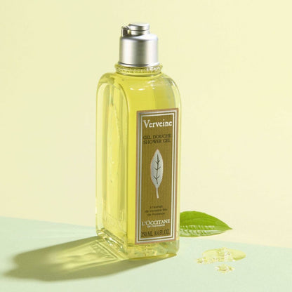 L'Occitane Verveine shower gel bottle on a light green background