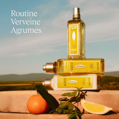 Three bottles of Routine Verveine Agrumes products with a scenic background