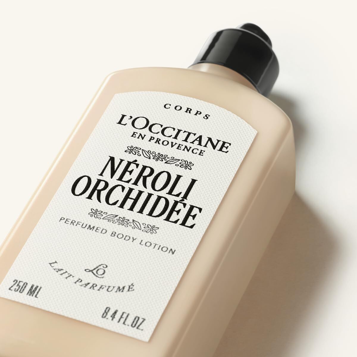 L'Occitane Nérolle Orchidée body lotion bottle on a white background