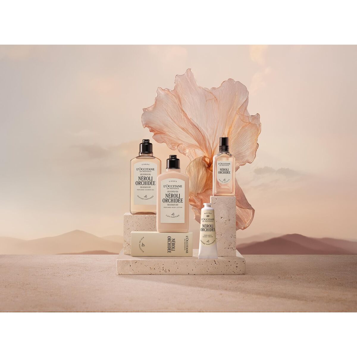 Cosmetic products with a large pink flower on a neutral background