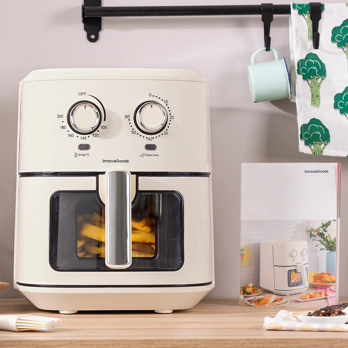 White air fryer on a kitchen counter with a blurred background